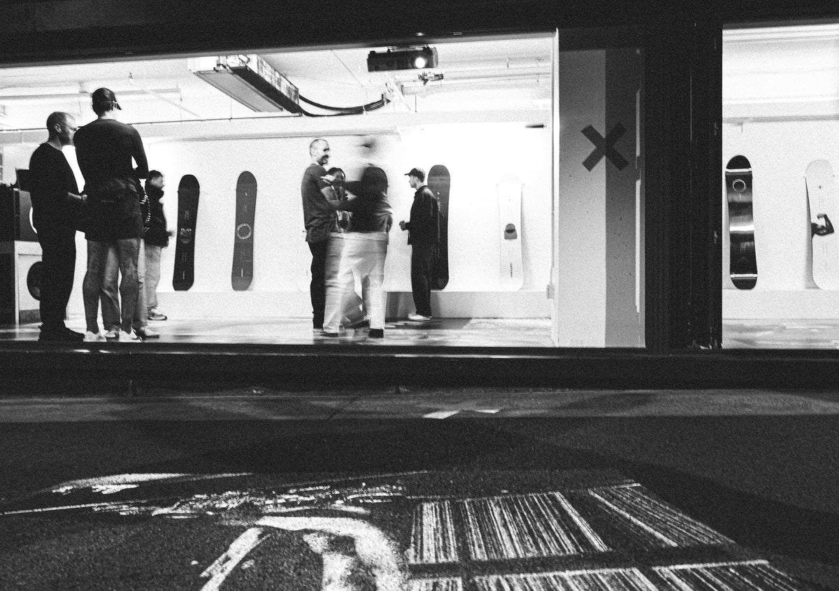 The Endeavor art show on opening night, seen from the alley through the studio windows
