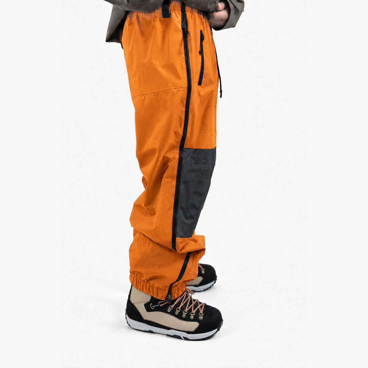 Endeavor 2L Ranger Pant in Blaze, on model, leg close-up