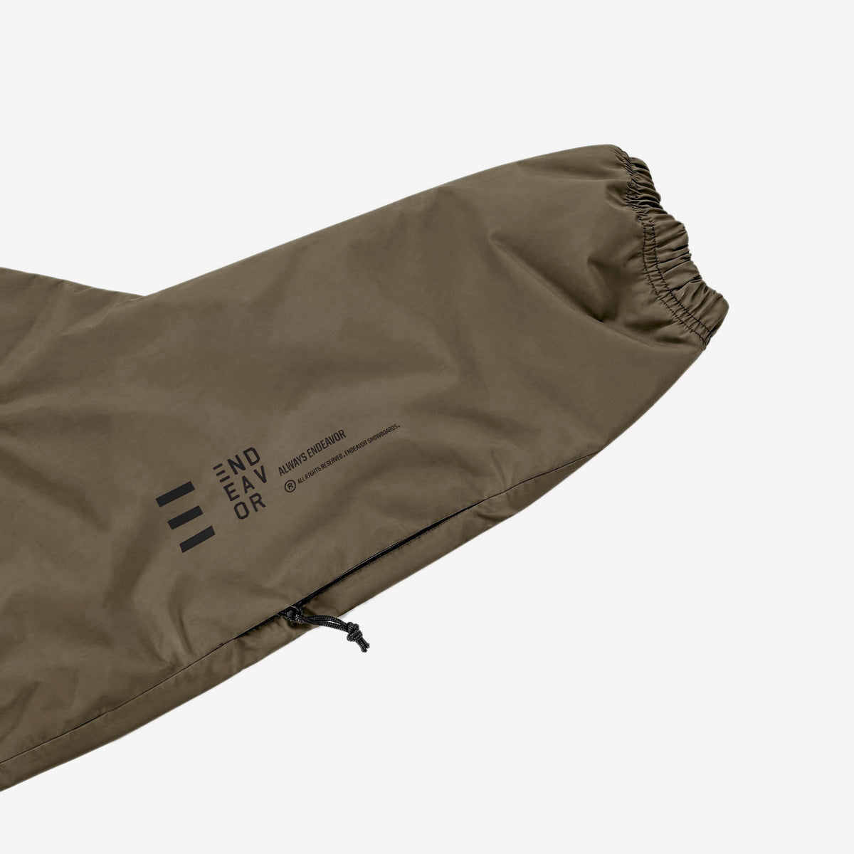 Endeavor 20K Windbreaker in Algae, forearm print END/EAV/OR with ALWAYS ENDEAVOR and arm-pocket zip