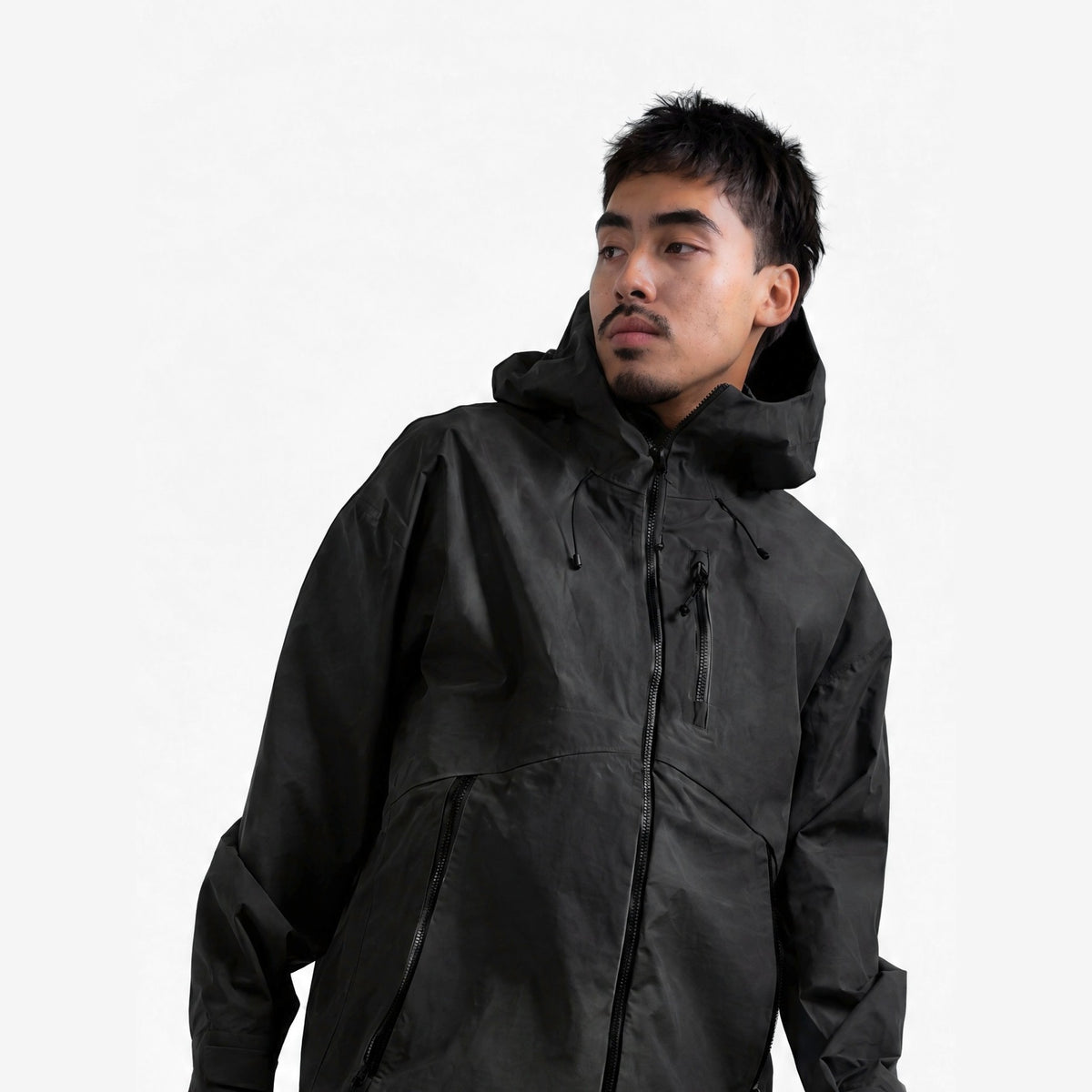 Endeavor 3L Shelter Jacket in Black, on model, waist-up