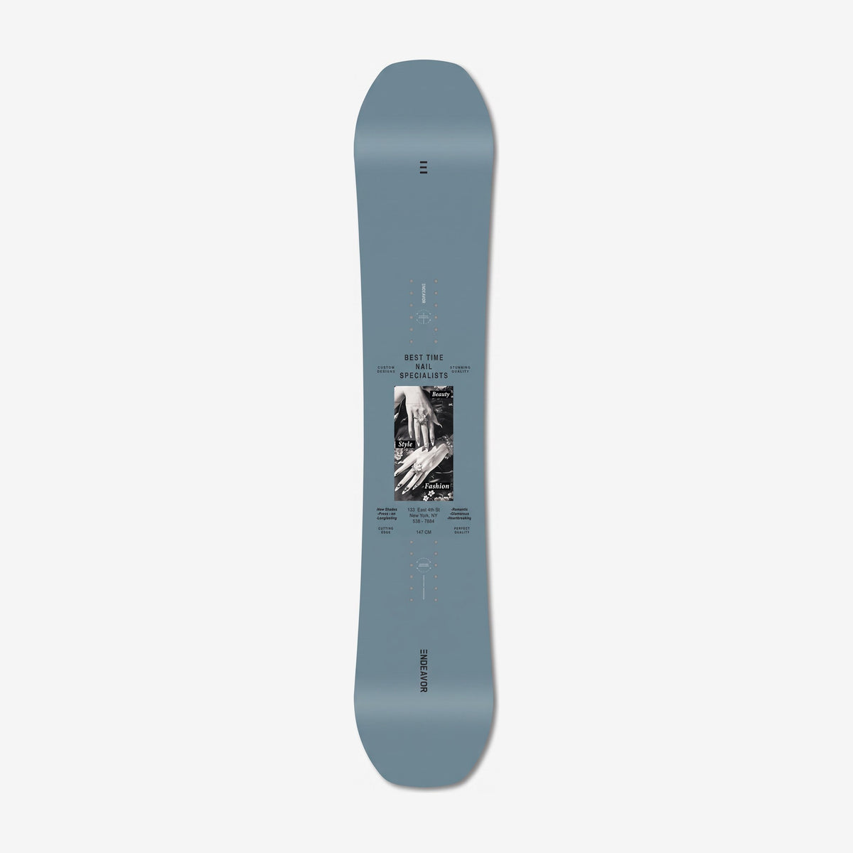 Endeavor Ranger Women's snowboard, topsheet: slate teal topsheet with the Best Time Nail Specialists ad block
