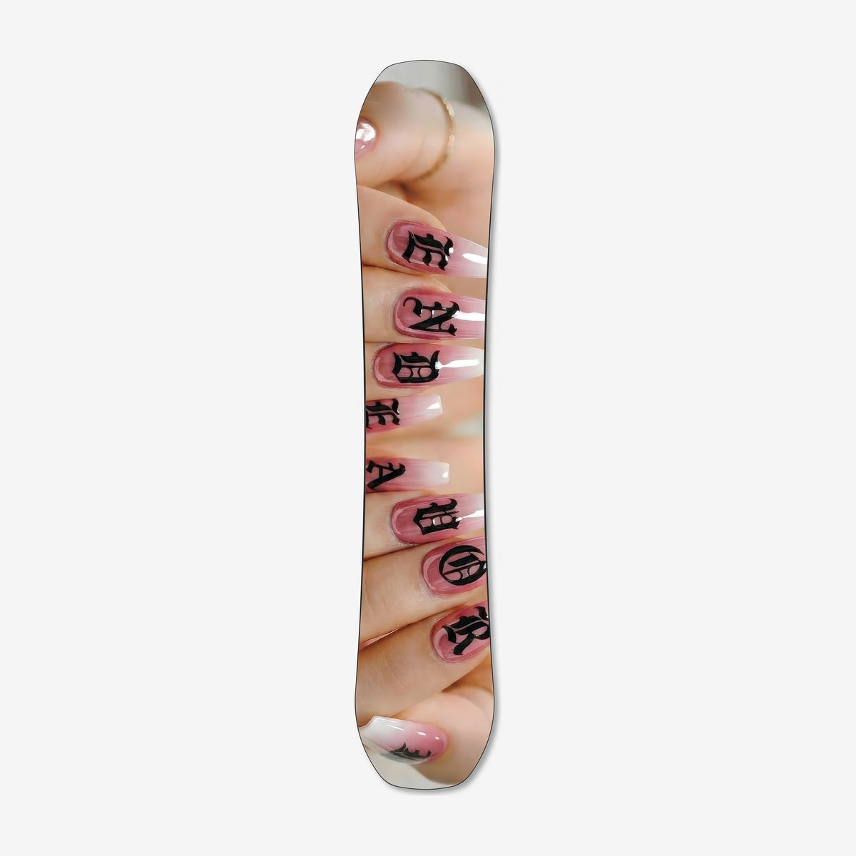 Endeavor Ranger Women's snowboard, base: photograph of pink nails with black letters spelling ENDEAVOR
