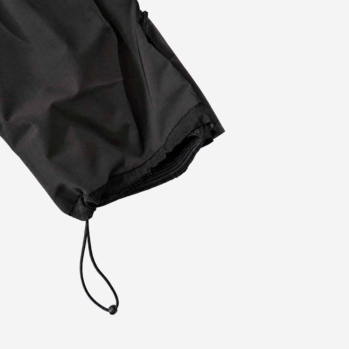 Endeavor 2L Patrol Cargo Pant in Black, elastic leg gaiter and hem drawcord