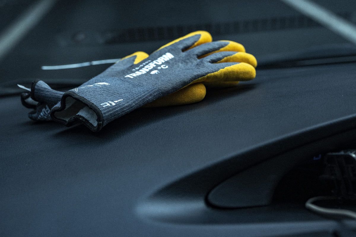 Transform Workwear gloves on a car dashboard. Photo: Mason Mashon