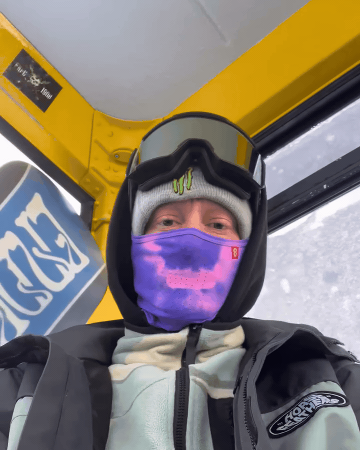Adrian Formella breathing into a Purple Airhole Hyper Hole in a gondola, the mask turning pink where his breath hits it