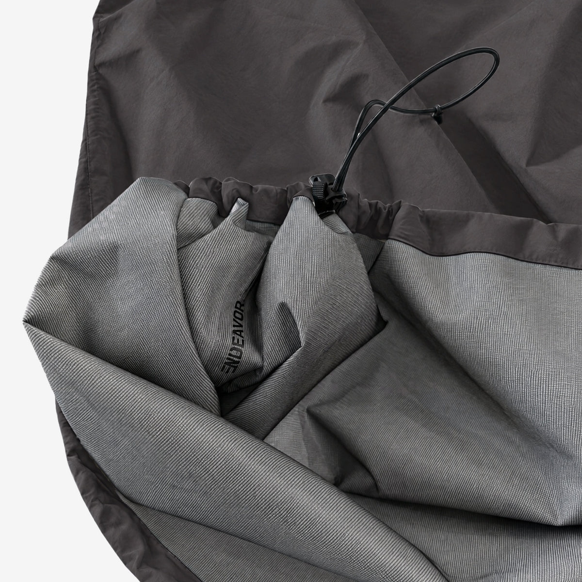 Endeavor 3L Scout Poncho Black, cinched hem with cord and toggle, lining folded out