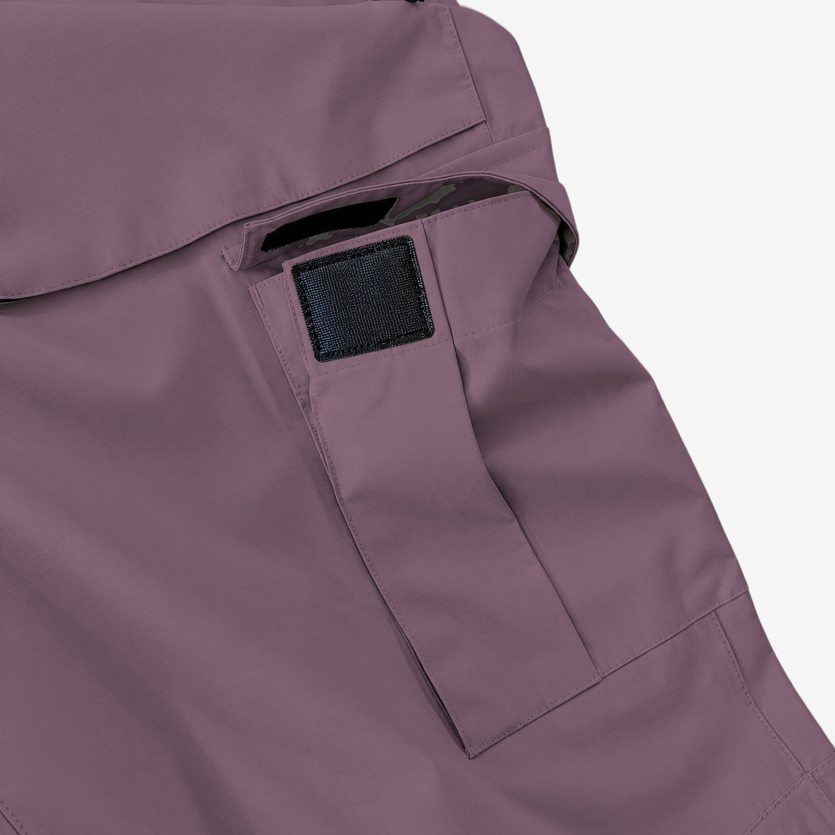 Endeavor 2L Patrol Cargo Pant in Burgundy, cargo pocket with its flap lifted and the hook-and-loop tab