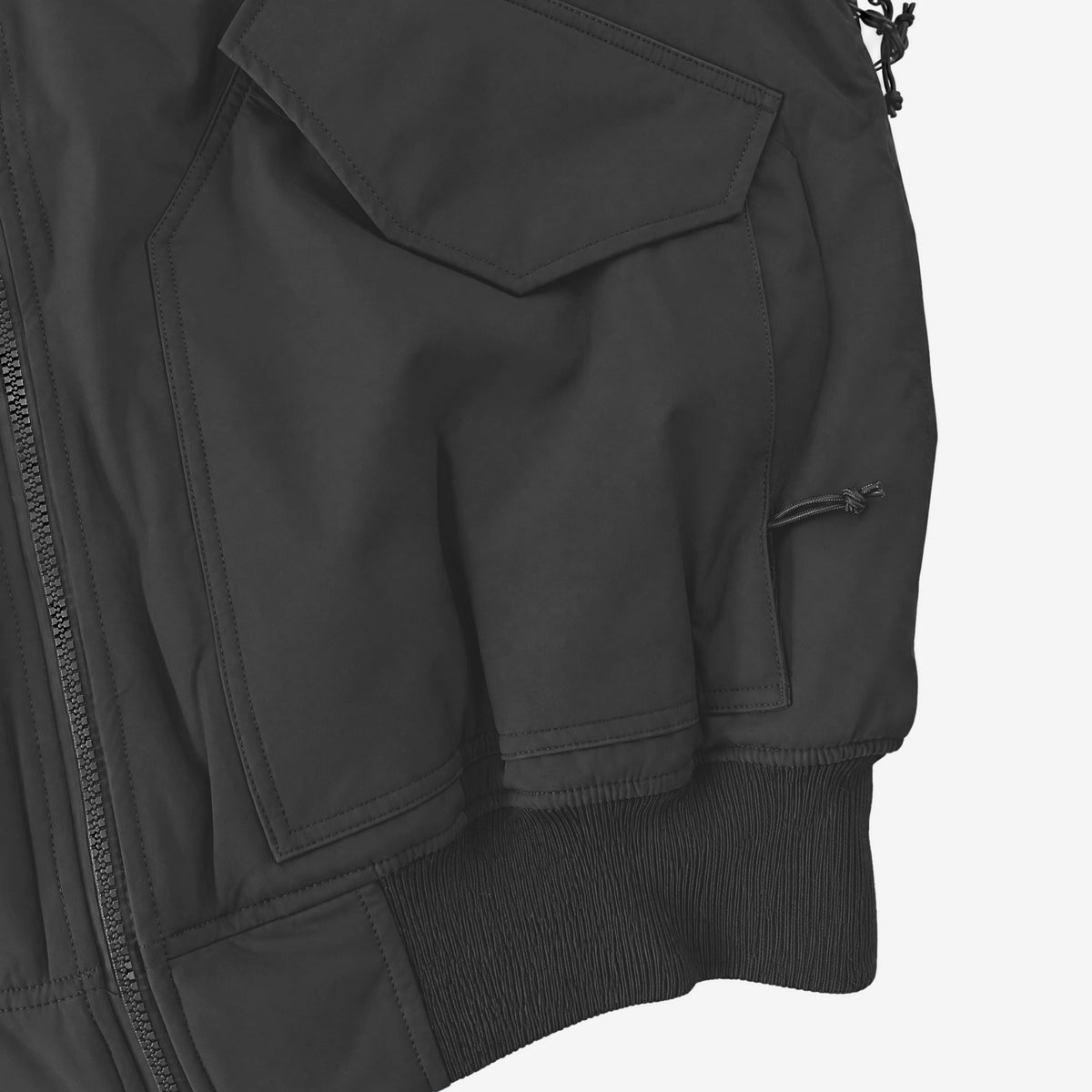 Endeavor 2L Bomber Jacket in Black, lower flap pocket, hand pocket and rib-knit hem