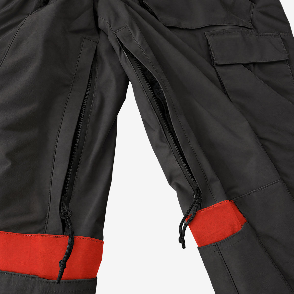 Endeavor 2L Patrol Cargo Pant in Black, inner leg vents unzipped to the mesh lining, with the knee tabs