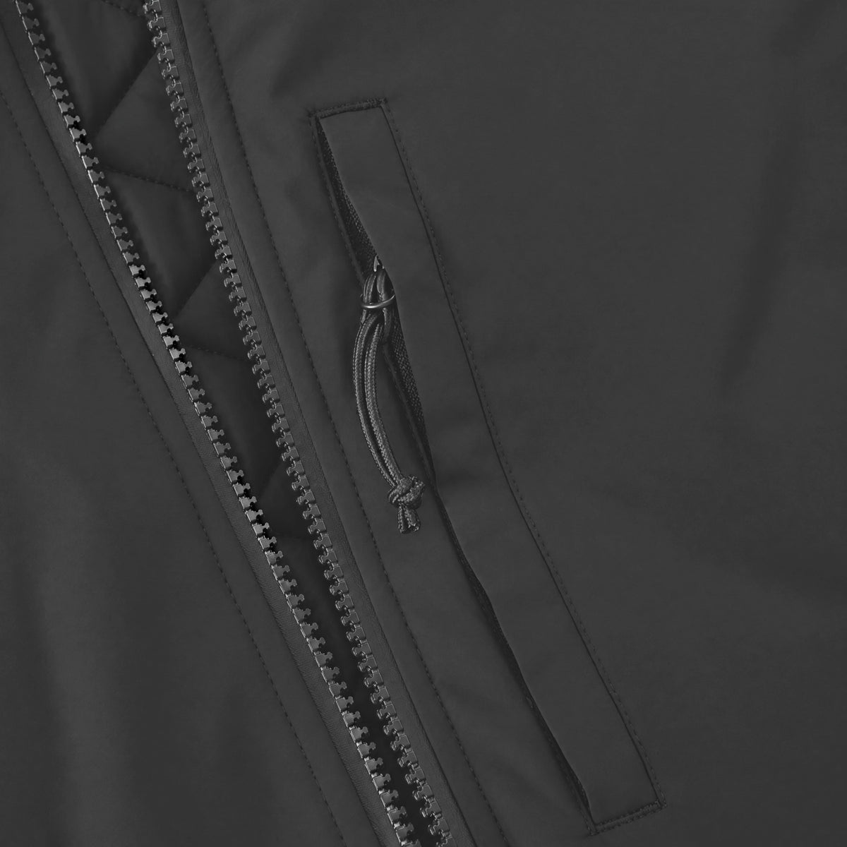 Endeavor 2L Bomber Jacket in Black, vertical zip chest pocket beside the two-way front zip
