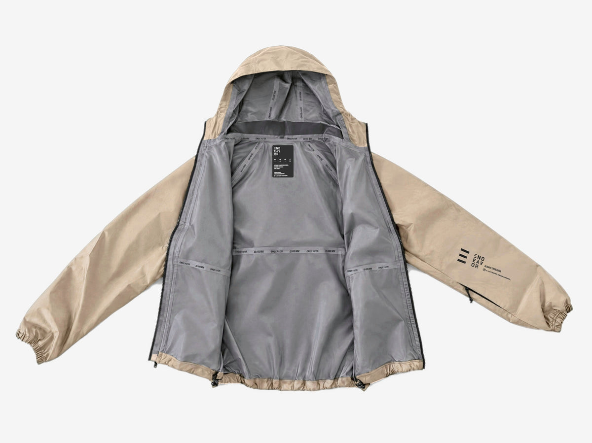 Endeavor 20K Windbreaker in Fiber, laid open showing the grey lining, printed seam tapes and inner label