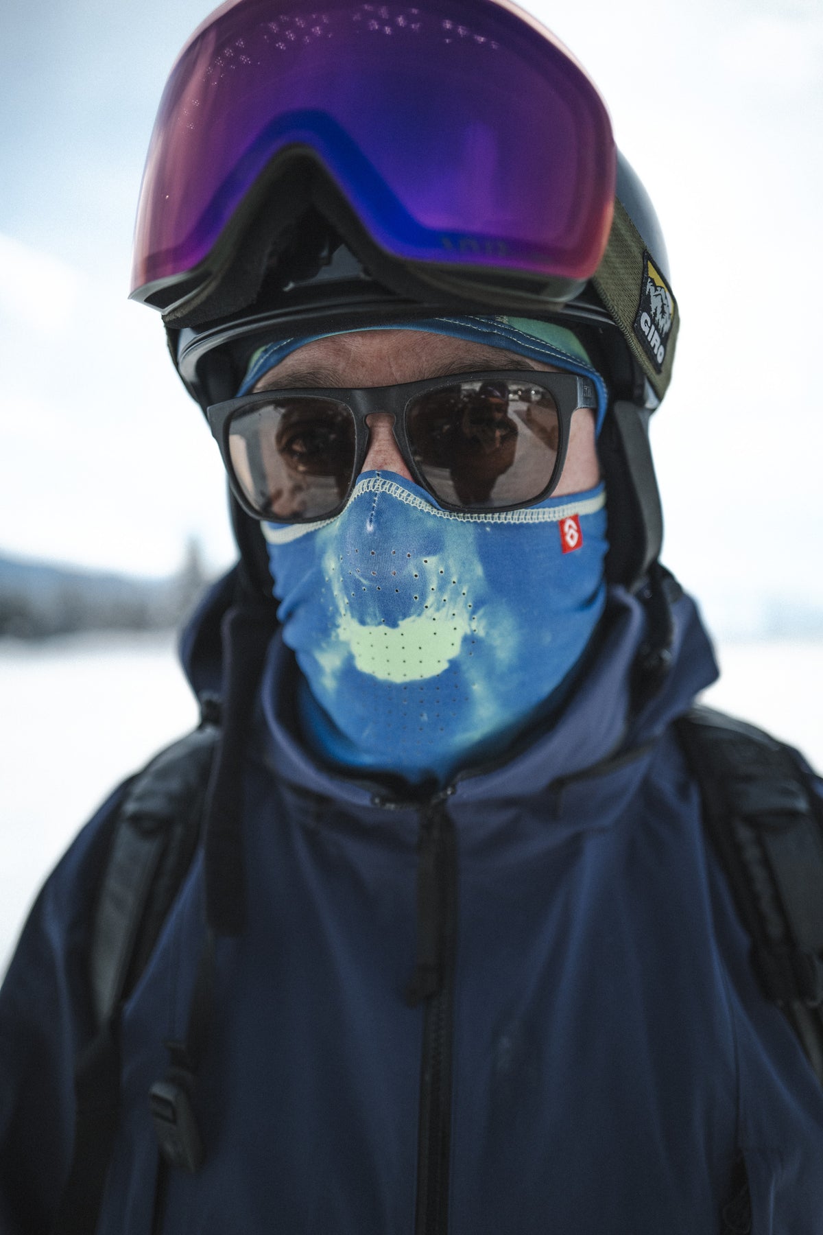 Airhole Hyper Hole in Aqua on snow, turned green at the mouth where breath warmed the fabric