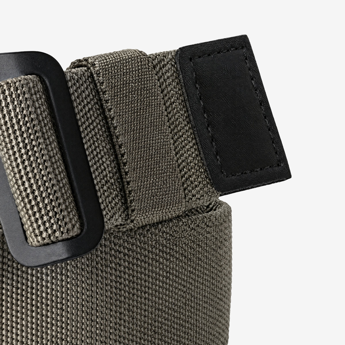Close-up of the Field Belt keeper loop and black end tab