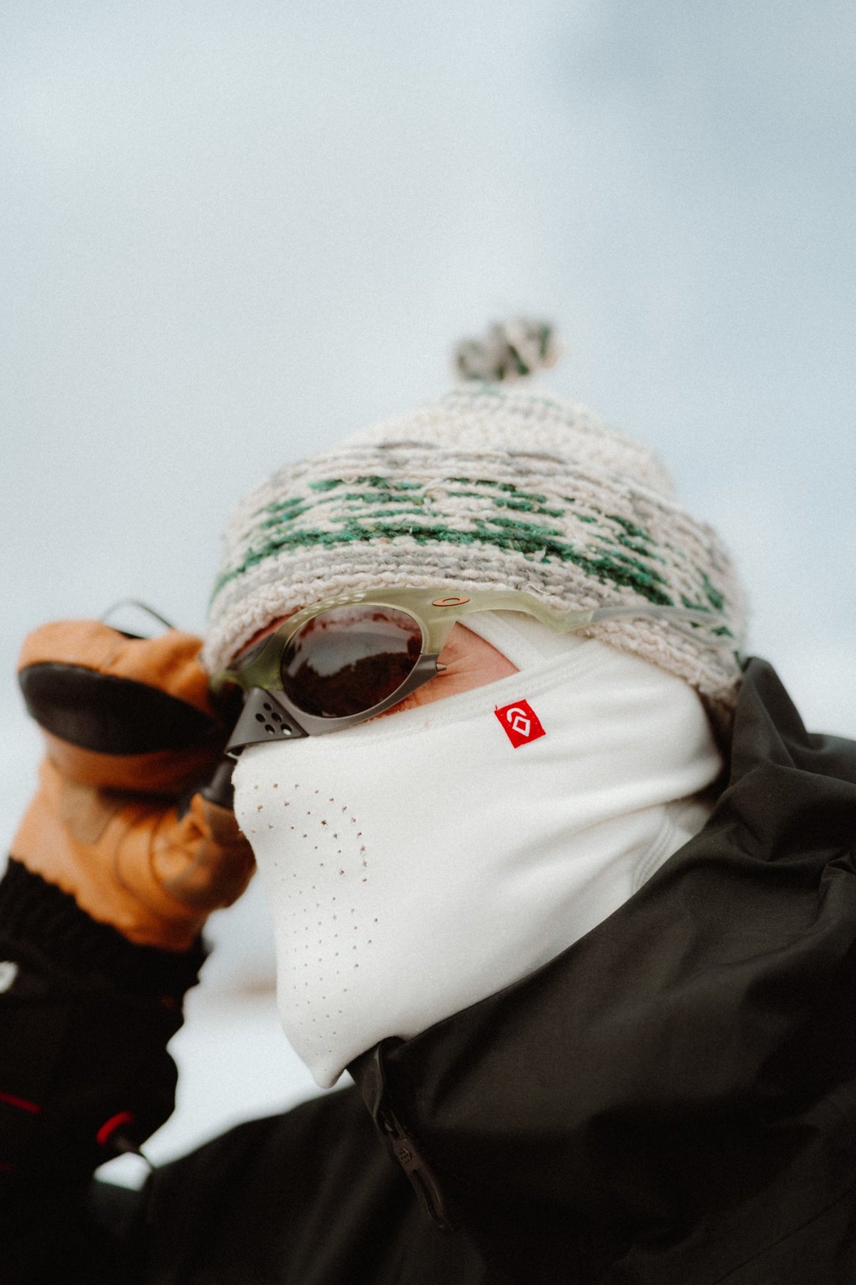 Rider in a white Airhole balaclava with Laser micro-airholes, knit toque and sunglasses