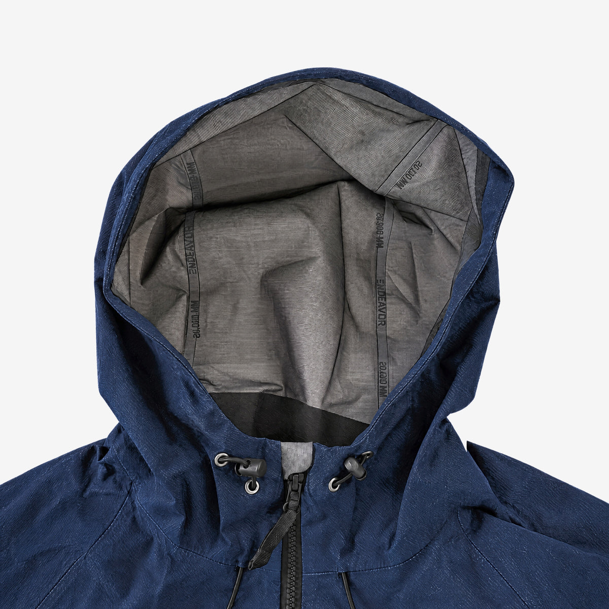 Endeavor 20K Windbreaker Limited Edition in Raw Denim, hood with grey mesh lining and taped seams, hood drawcords and front zip