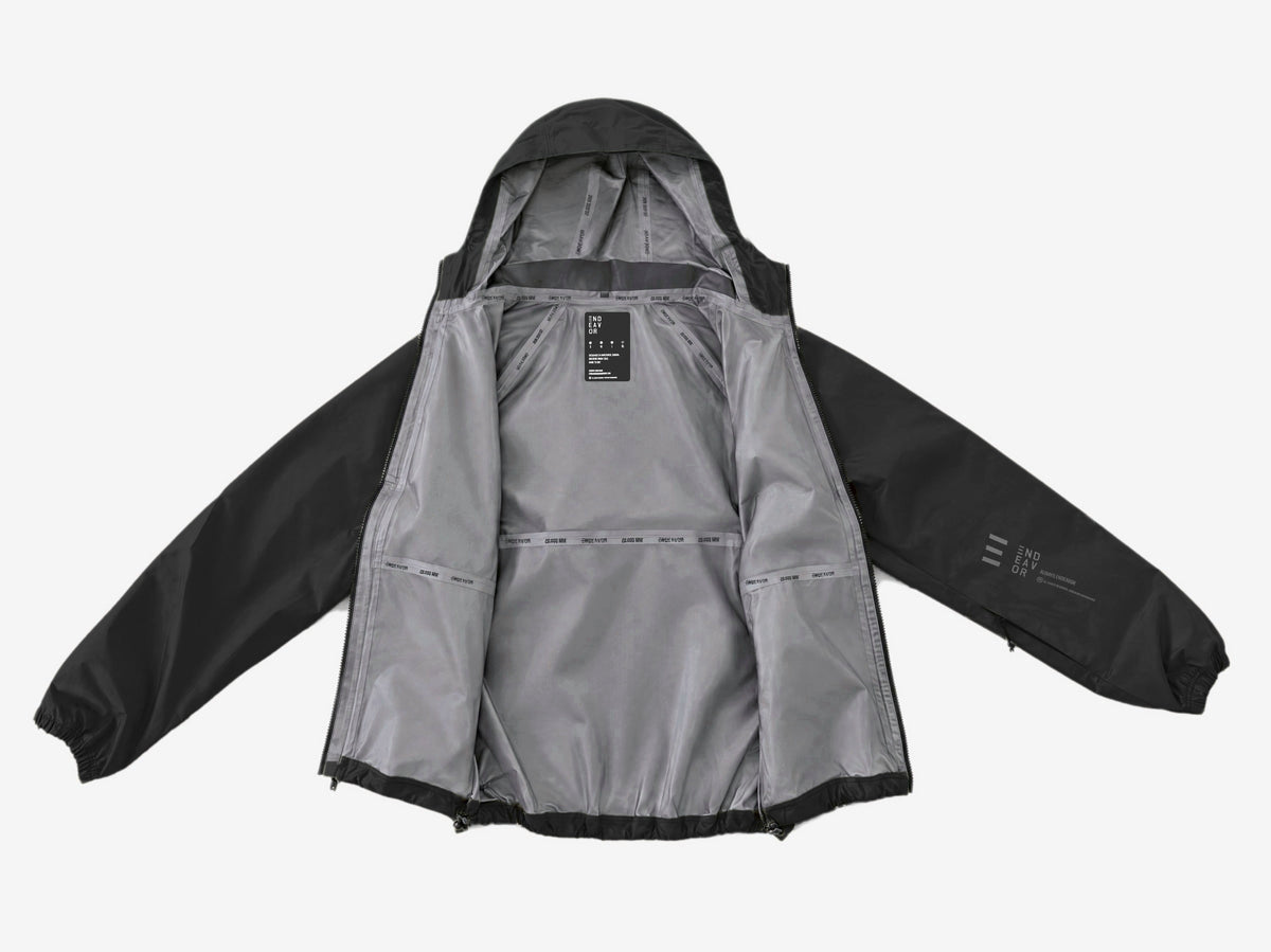 Endeavor 20K Windbreaker in Black, laid open showing the grey lining, printed seam tapes and inner label
