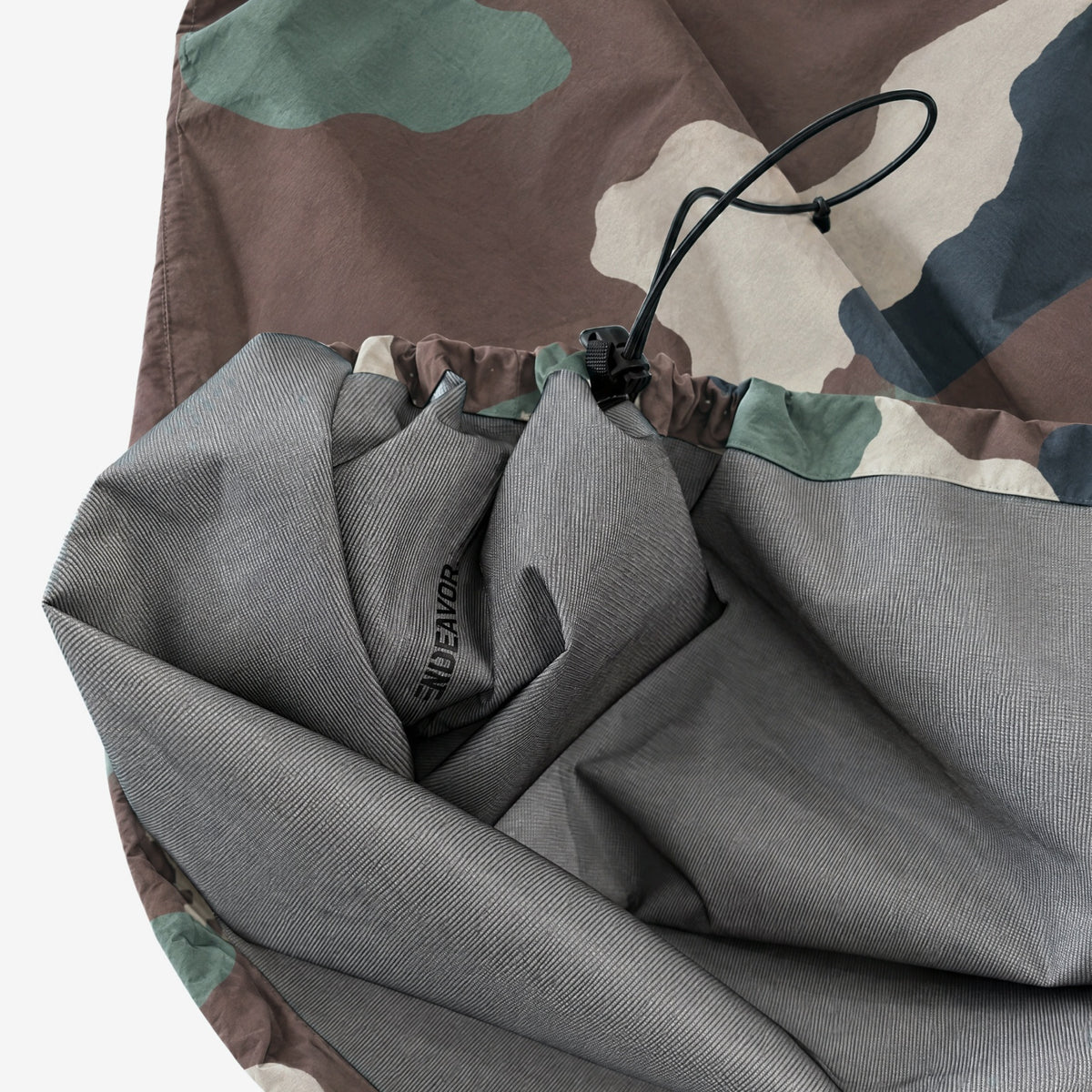 Endeavor 3L Scout Poncho Woodland Camo, cinched hem with cord and toggle, lining folded out