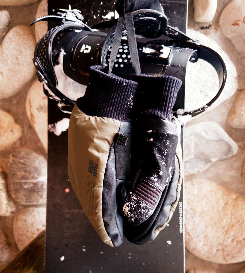 Transform KO Mitt in Silt on a snowboard binding